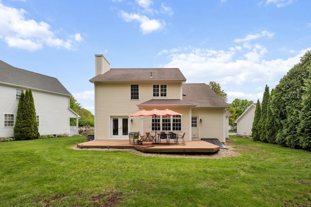 9 Baldwin Dr, Farmington, CT 06032 - rear view of property with french doors, a wooden deck, a yard, and a chimney