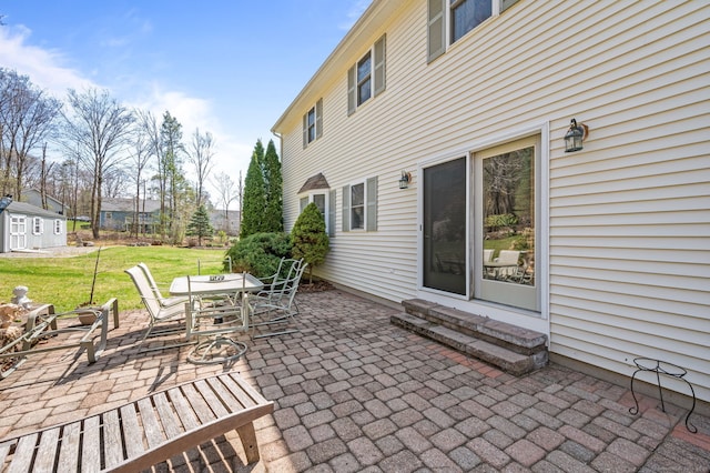 view of patio featuring entry steps and outdoor dining space