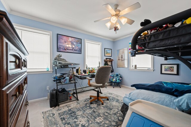 bedroom featuring carpet, baseboards, crown molding, and ceiling fan