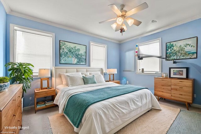 carpeted bedroom featuring baseboards, ornamental molding, and a ceiling fan