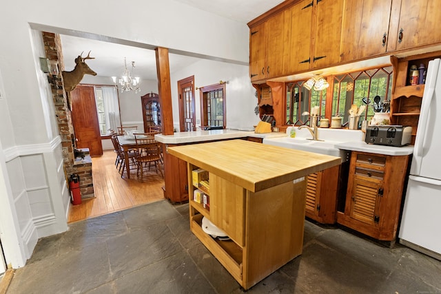 45 Roseland Park Rd, Woodstock, CT 06281 - kitchen with wooden counters, a chandelier, open shelves, freestanding refrigerator, and healthy amount of natural light