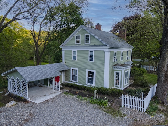 45 Roseland Park Rd, Woodstock, CT 06281 - greek revival inspired property featuring a chimney, fence, a shingled roof, and driveway