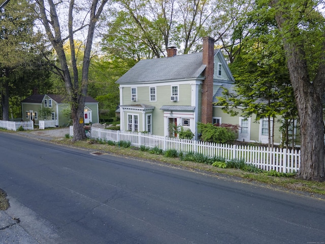 45 Roseland Park Rd, Woodstock, CT 06281 - view of front facade with a chimney and a fenced front yard