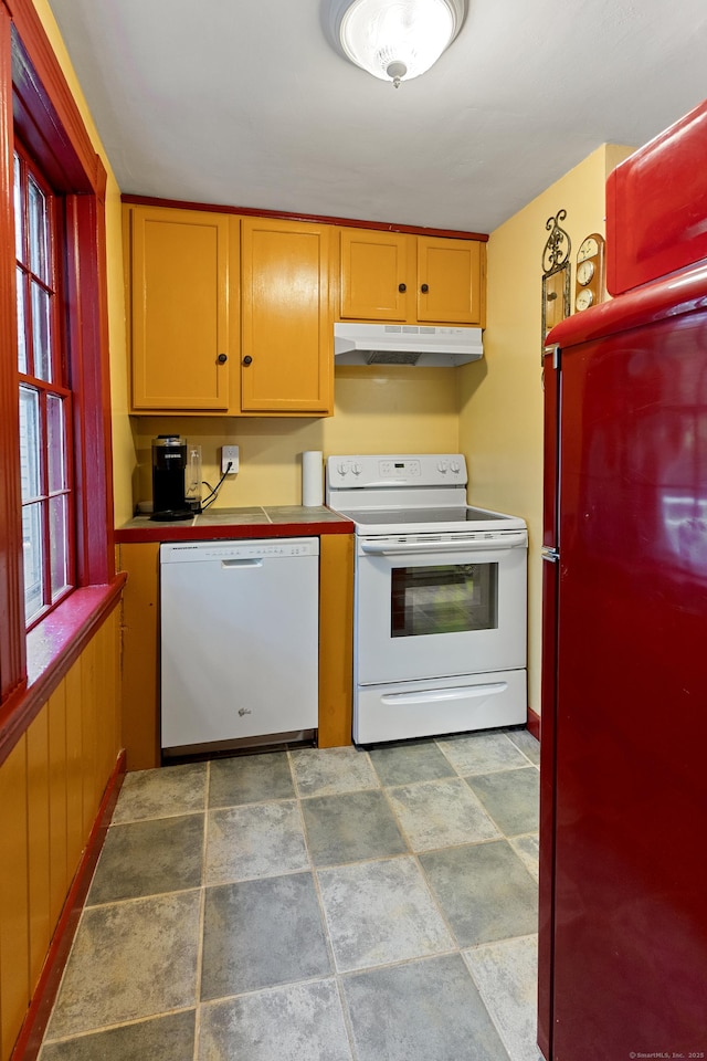 45 Roseland Park Rd, Woodstock, CT 06281 - kitchen featuring white appliances, under cabinet range hood, and stone finish floors