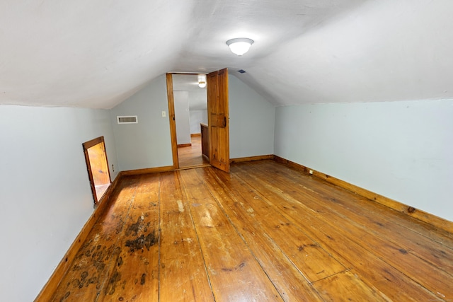 45 Roseland Park Rd, Woodstock, CT 06281 - additional living space with wood-type flooring, lofted ceiling, and baseboards