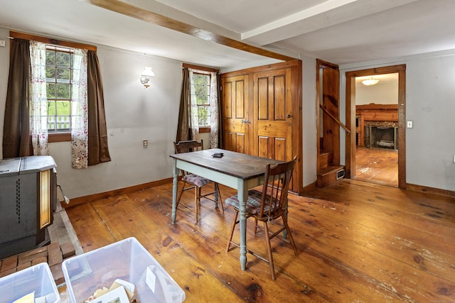 45 Roseland Park Rd, Woodstock, CT 06281 - dining space featuring hardwood / wood-style flooring, beam ceiling, baseboards, and stairs