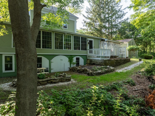 45 Roseland Park Rd, Woodstock, CT 06281 - back of property with a wooden deck and a sunroom