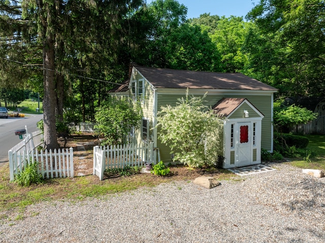 45 Roseland Park Rd, Woodstock, CT 06281 - obstructed view of property featuring roof with shingles and an outbuilding