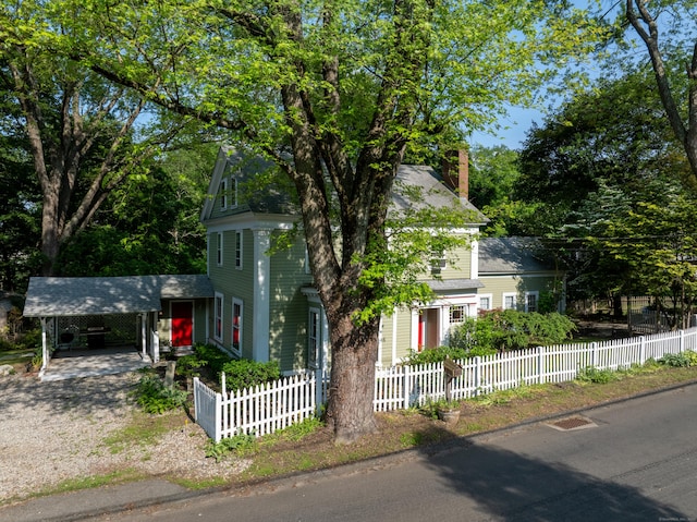 45 Roseland Park Rd, Woodstock, CT 06281 - view of front of home featuring a carport, a fenced front yard, and dirt driveway
