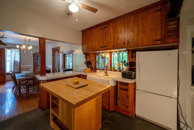 45 Roseland Park Rd, Woodstock, CT 06281 - kitchen featuring freestanding refrigerator, butcher block countertops, a peninsula, a ceiling fan, and a chandelier