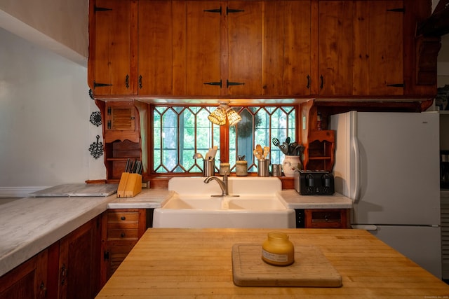 45 Roseland Park Rd, Woodstock, CT 06281 - kitchen featuring freestanding refrigerator, wood counters, and brown cabinets