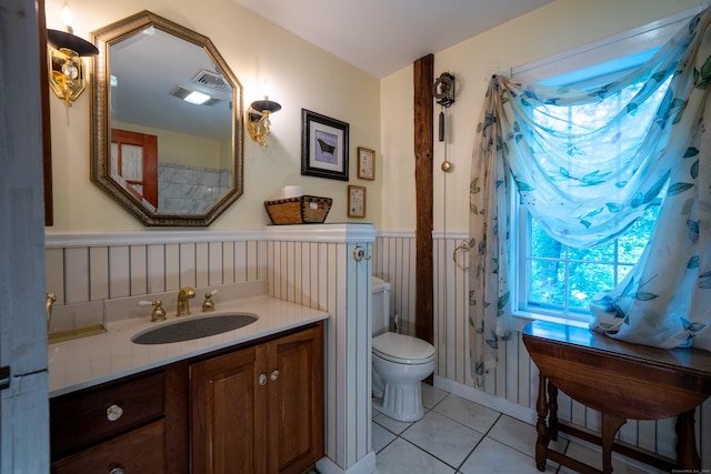 45 Roseland Park Rd, Woodstock, CT 06281 - bathroom featuring tile patterned floors, vanity, and a wainscoted wall