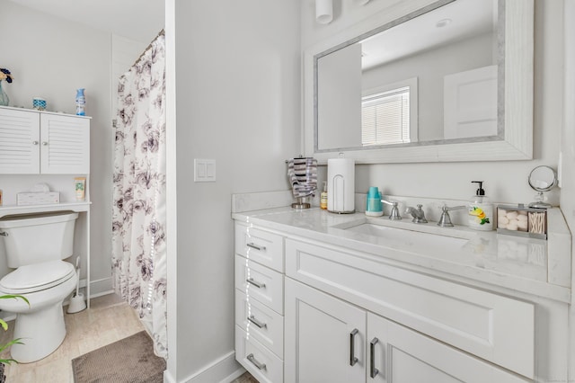 74 Sterling St, Fairfield, CT 06825 - full bathroom featuring toilet, baseboards, vanity, and curtained shower