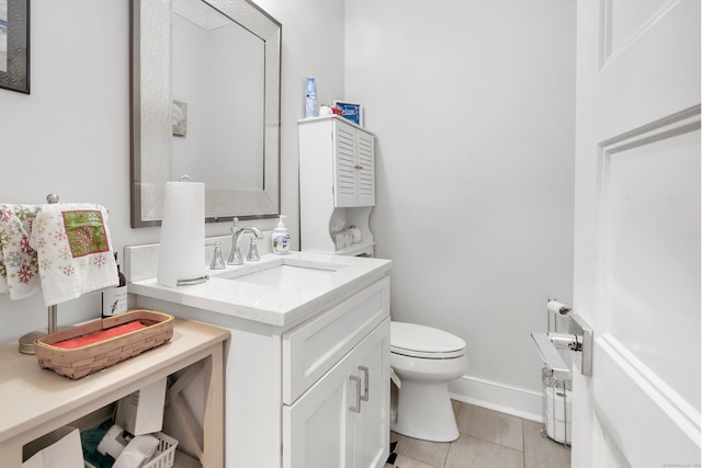 74 Sterling St, Fairfield, CT 06825 - half bath featuring vanity, toilet, baseboards, and tile patterned flooring