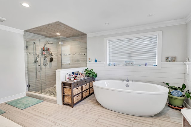 74 Sterling St, Fairfield, CT 06825 - full bathroom with a stall shower, crown molding, recessed lighting, and a freestanding tub