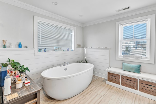 74 Sterling St, Fairfield, CT 06825 - bathroom with a freestanding bath, crown molding, and visible vents