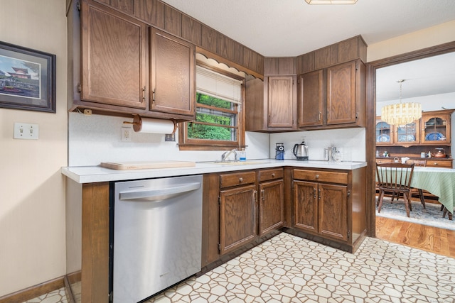 214 Candlewyck Dr, Newington, CT 06111 - kitchen with light countertops, a sink, a notable chandelier, baseboards, and dishwasher