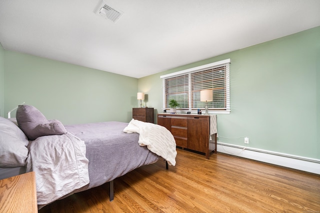 214 Candlewyck Dr, Newington, CT 06111 - bedroom with light wood-type flooring, visible vents, and baseboard heating