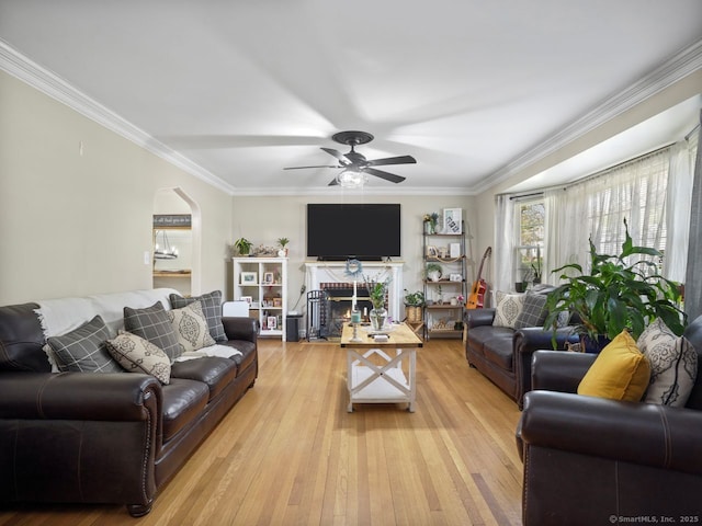 134 Painter Ave, West Haven, CT 06516 - living area featuring a fireplace with flush hearth, ornamental molding, a ceiling fan, and light wood-type flooring