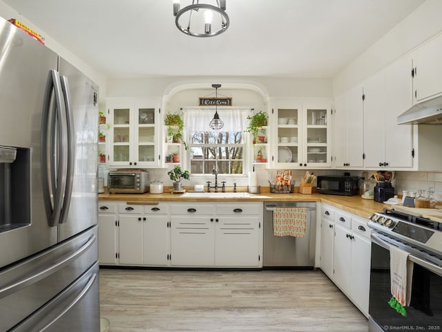 134 Painter Ave, West Haven, CT 06516 - kitchen featuring backsplash, appliances with stainless steel finishes, a sink, and a toaster