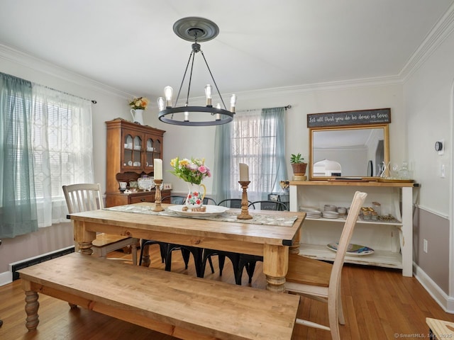 134 Painter Ave, West Haven, CT 06516 - dining area featuring crown molding, baseboards, a notable chandelier, and plenty of natural light
