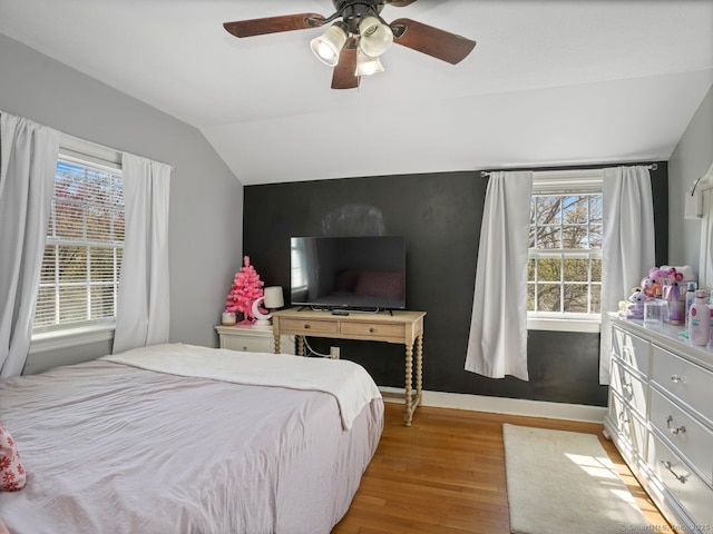 134 Painter Ave, West Haven, CT 06516 - bedroom featuring baseboards, a ceiling fan, vaulted ceiling, and light wood-type flooring