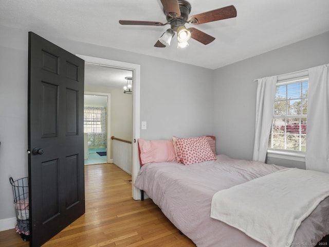 134 Painter Ave, West Haven, CT 06516 - bedroom featuring ceiling fan, multiple windows, and light wood-style floors