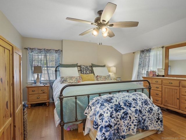 134 Painter Ave, West Haven, CT 06516 - bedroom with a ceiling fan, vaulted ceiling, multiple windows, and light wood-style flooring