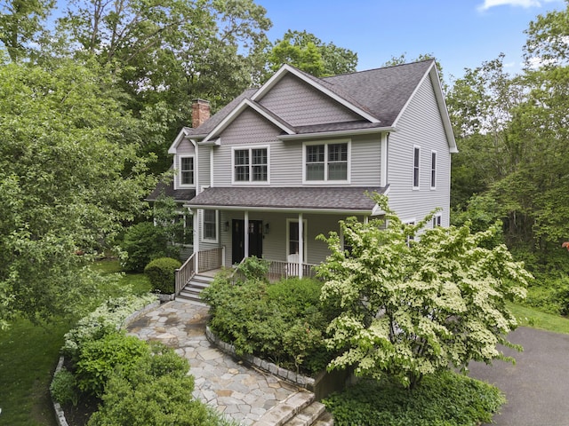 202 Horse Hill Rd, Westbrook, CT 06498 - view of front of house with a chimney, covered porch, and roof with shingles