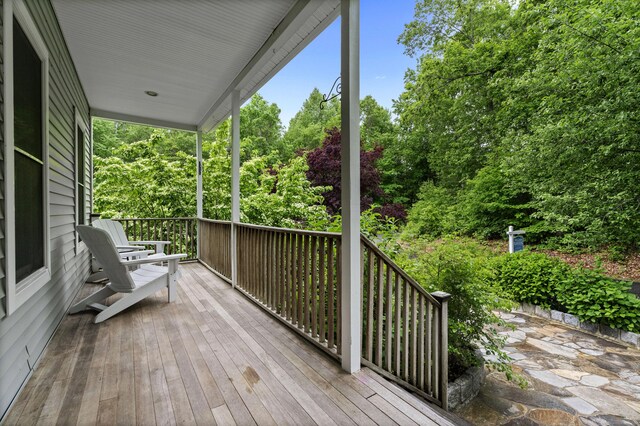 202 Horse Hill Rd, Westbrook, CT 06498 - wooden porch featuring view of wooded area