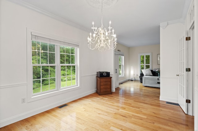 202 Horse Hill Rd, Westbrook, CT 06498 - dining area featuring a chandelier, plenty of natural light, light wood-style floors, and baseboards