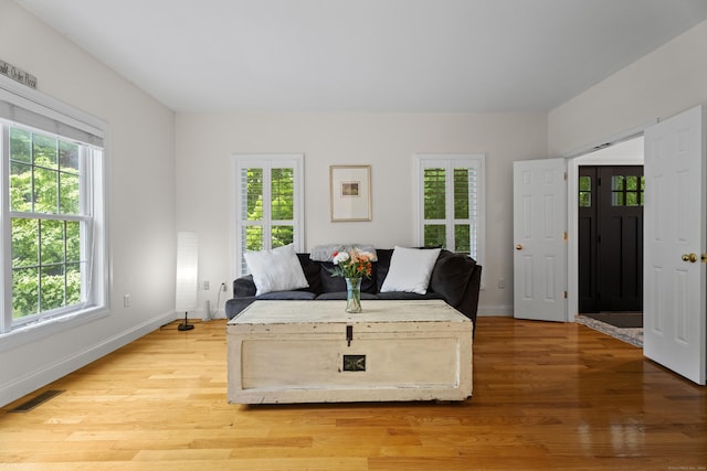 202 Horse Hill Rd, Westbrook, CT 06498 - living room with healthy amount of natural light, baseboards, and light wood-type flooring