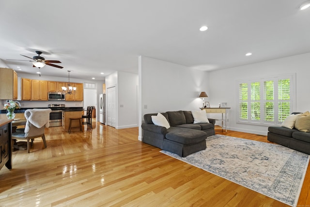 202 Horse Hill Rd, Westbrook, CT 06498 - living room with a chandelier, light wood-style floors, recessed lighting, ceiling fan, and baseboards
