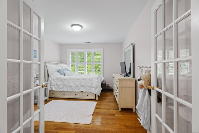 202 Horse Hill Rd, Westbrook, CT 06498 - bedroom featuring french doors and light wood-style floors