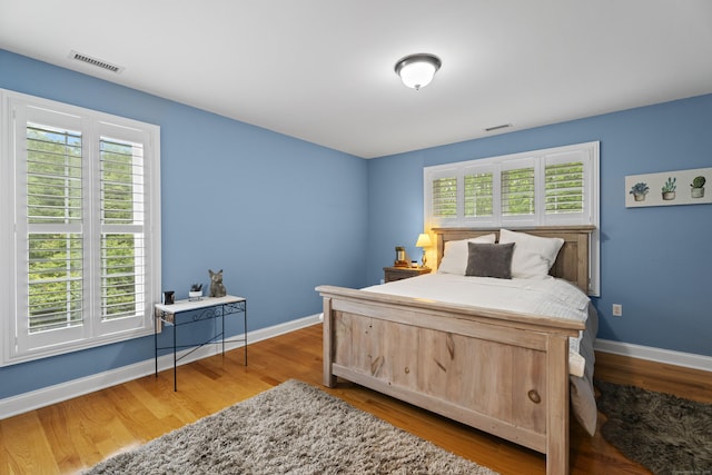 202 Horse Hill Rd, Westbrook, CT 06498 - bedroom featuring multiple windows, baseboards, and wood finished floors