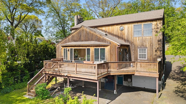 38 Skyline Dr, Brookfield, CT 06804 - back of property featuring a chimney, roof with shingles, a deck, and a garage