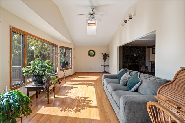 38 Skyline Dr, Brookfield, CT 06804 - living area featuring ceiling fan, vaulted ceiling, wood finished floors, a fireplace, and baseboards