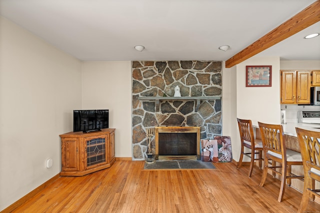 38 Skyline Dr, Brookfield, CT 06804 - living area featuring a stone fireplace, light wood-style floors, beamed ceiling, and baseboards