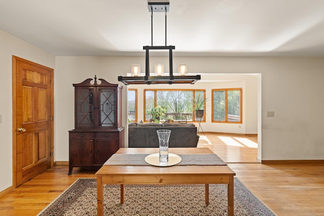 38 Skyline Dr, Brookfield, CT 06804 - dining area with a chandelier, light wood-style floors, and baseboards