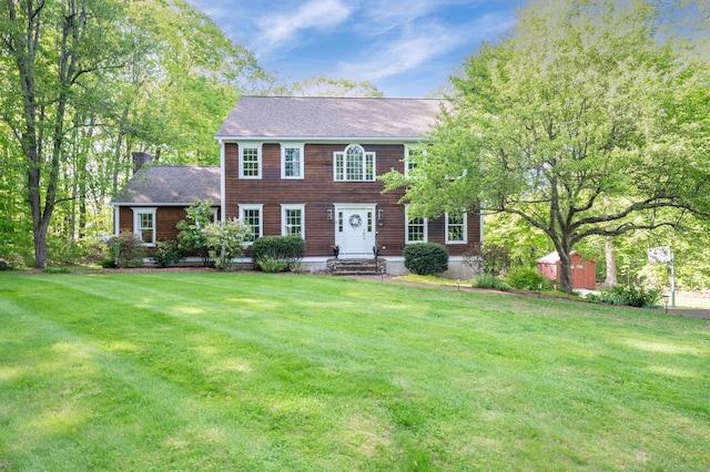 45 Wolf Pit Rd, Southbury, CT 06488 - colonial home with a front lawn, a chimney, and roof with shingles