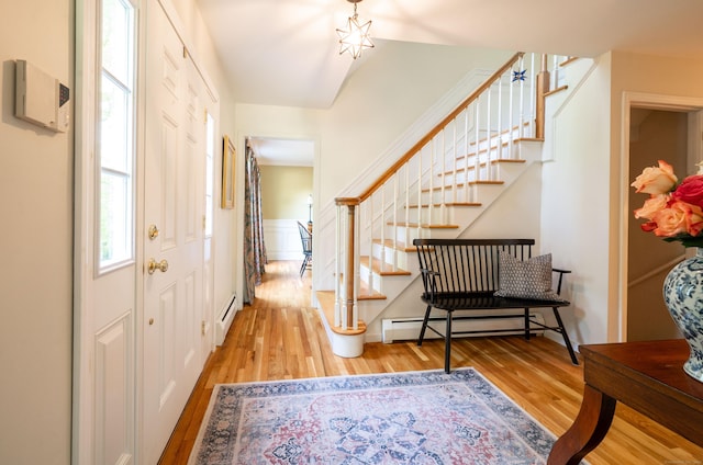 45 Wolf Pit Rd, Southbury, CT 06488 - entrance foyer with wood finished floors, a baseboard heating unit, and stairway