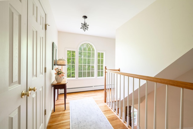 45 Wolf Pit Rd, Southbury, CT 06488 - corridor with a baseboard radiator, light wood-type flooring, and an upstairs landing