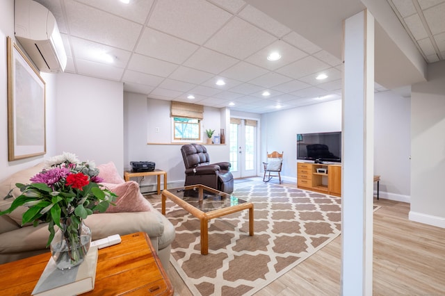 45 Wolf Pit Rd, Southbury, CT 06488 - living area featuring a wall mounted air conditioner, light wood-style floors, a paneled ceiling, baseboards, and recessed lighting