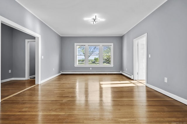 181 Westbourne Pkwy, Hartford, CT 06112 - interior space with baseboards, ornamental molding, a baseboard heating unit, and wood finished floors