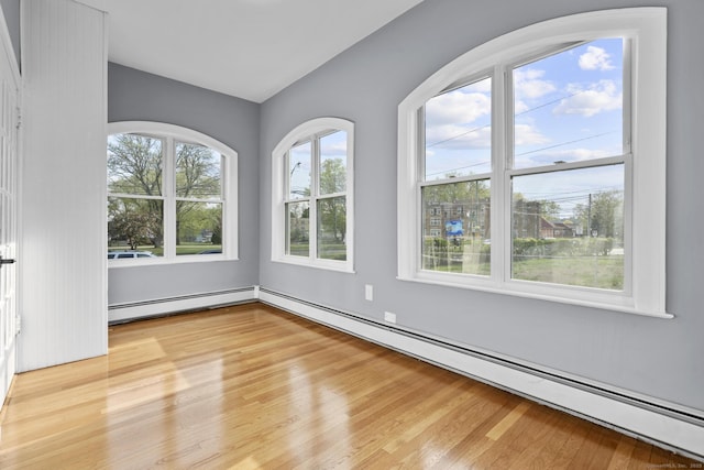 181 Westbourne Pkwy, Hartford, CT 06112 - empty room with light wood finished floors, vaulted ceiling, and baseboard heating