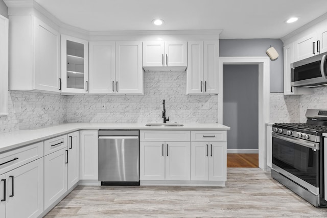 181 Westbourne Pkwy, Hartford, CT 06112 - kitchen featuring a sink, recessed lighting, backsplash, white cabinets, and appliances with stainless steel finishes