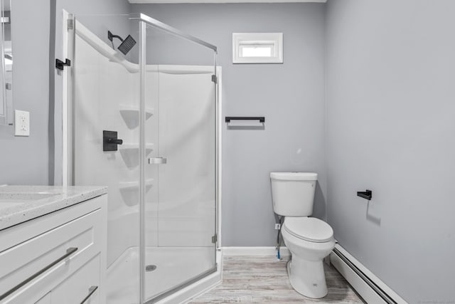181 Westbourne Pkwy, Hartford, CT 06112 - full bathroom featuring a stall shower, toilet, baseboards, a baseboard heating unit, and wood finished floors