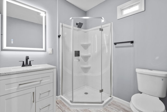 181 Westbourne Pkwy, Hartford, CT 06112 - full bathroom featuring a stall shower, toilet, baseboards, and wood finished floors