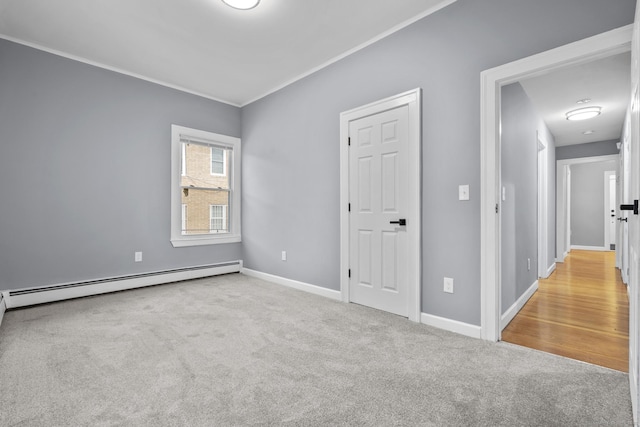 181 Westbourne Pkwy, Hartford, CT 06112 - carpeted empty room with crown molding, baseboards, and a baseboard heating unit
