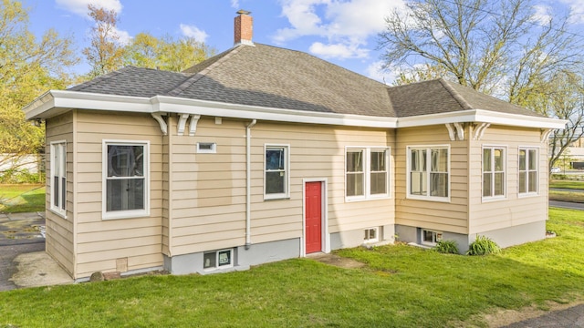 181 Westbourne Pkwy, Hartford, CT 06112 - rear view of property featuring a yard, roof with shingles, and a chimney